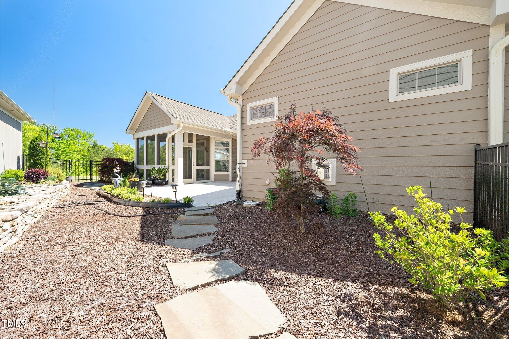 1356 Prevenient Drive Wake Forest, NC 27587 - Photo 27 of 27 a view of a house with backyard and sitting area