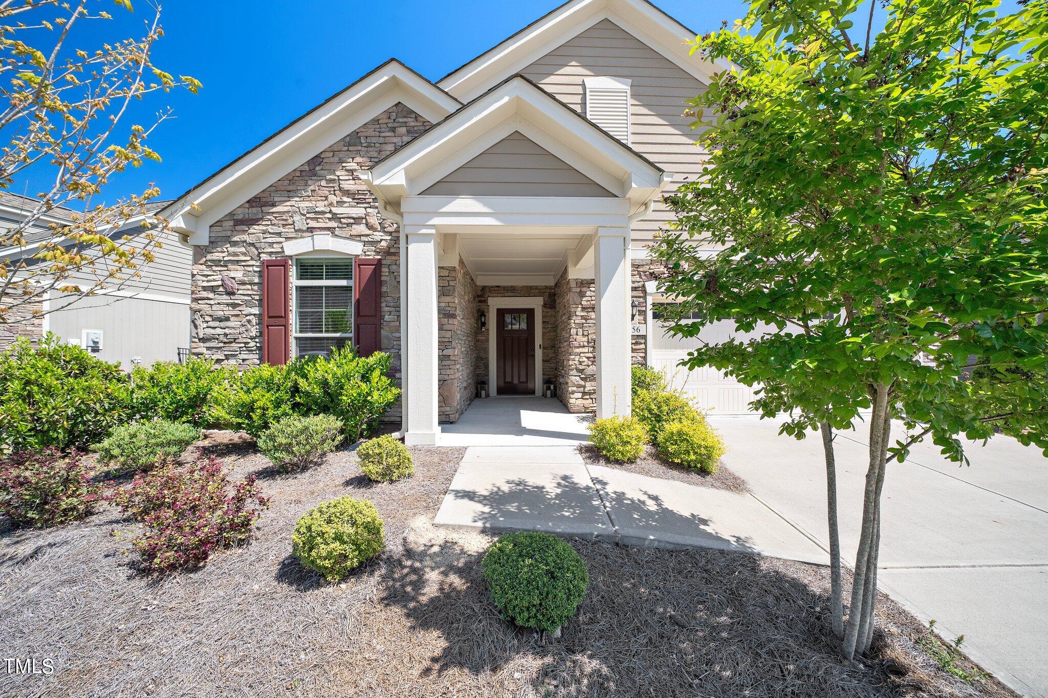 1356 Prevenient Drive Wake Forest, NC 27587 - Photo 3 of 27 a front view of a house with garden