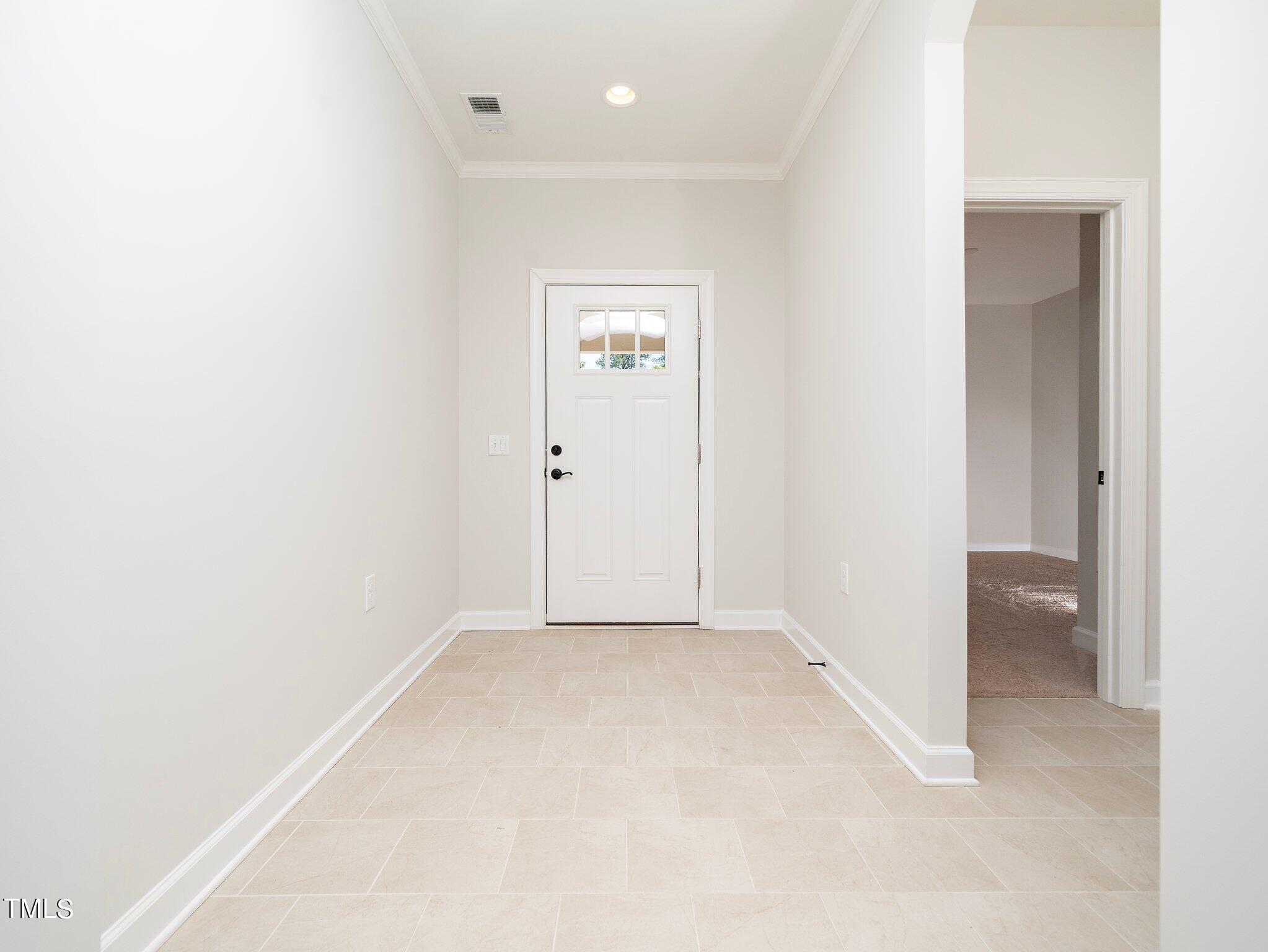 1356 Prevenient Drive Wake Forest, NC 27587 - Photo 4 of 27 an empty room with closet and mirror