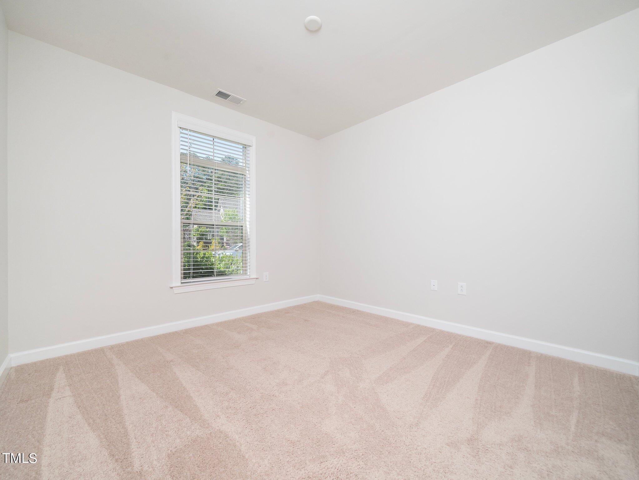 1356 Prevenient Drive Wake Forest, NC 27587 - Photo 5 of 27 an empty room with windows