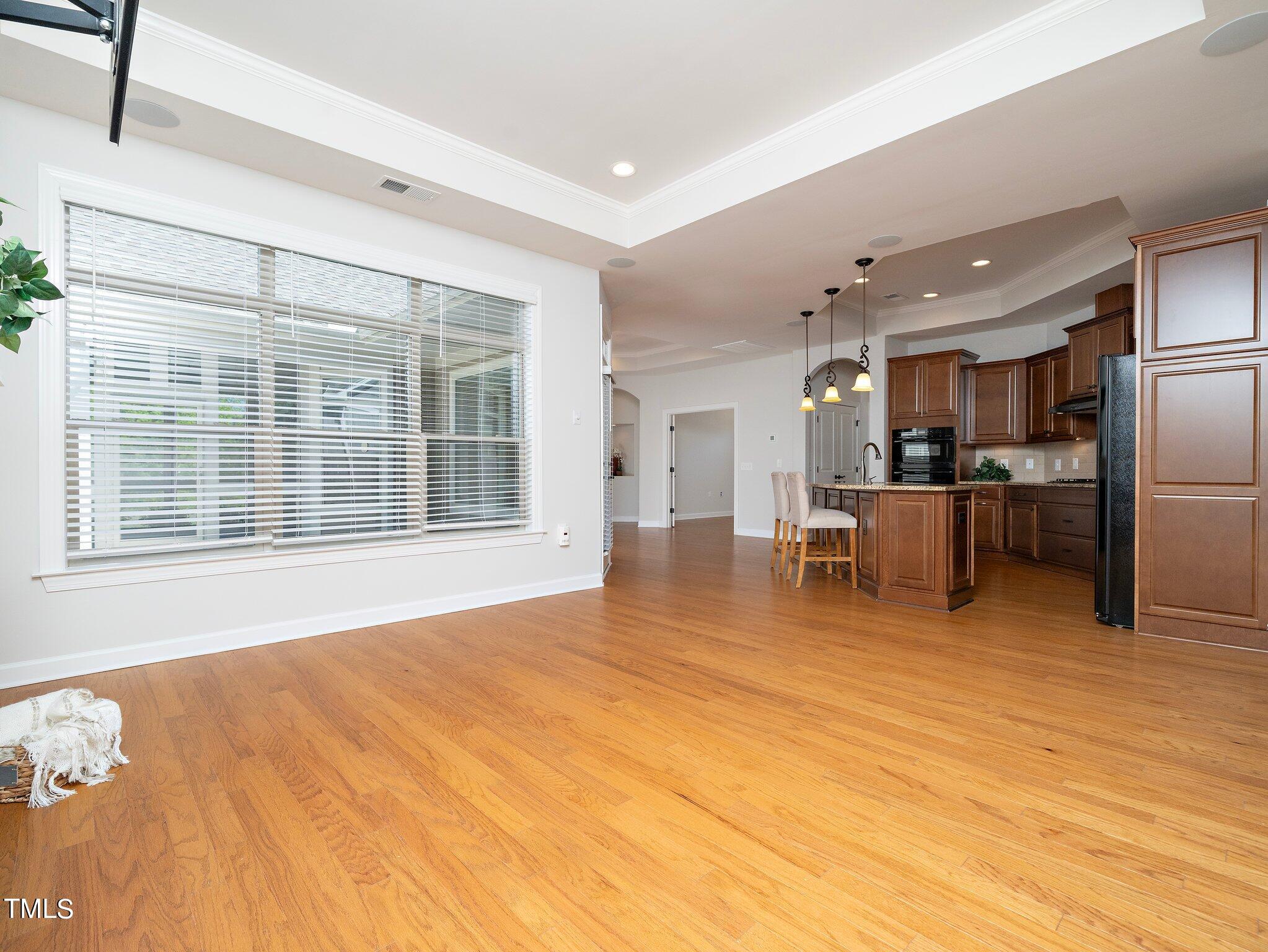 1356 Prevenient Drive Wake Forest, NC 27587 - Photo 9 of 27 a view of an empty room with kitchen appliances and windows