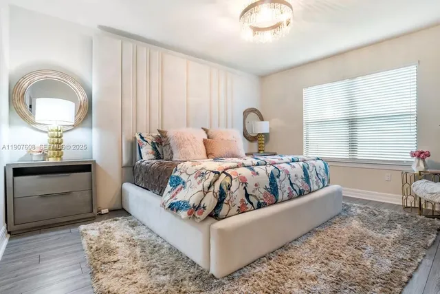 a bed room with a bed and a dresser