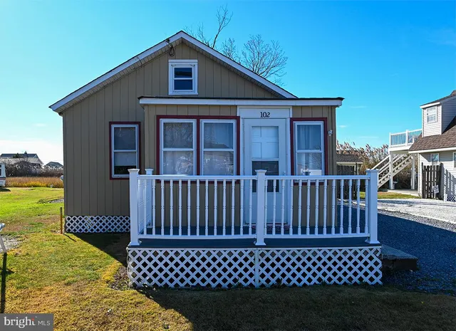 a view of a house with a wooden deck