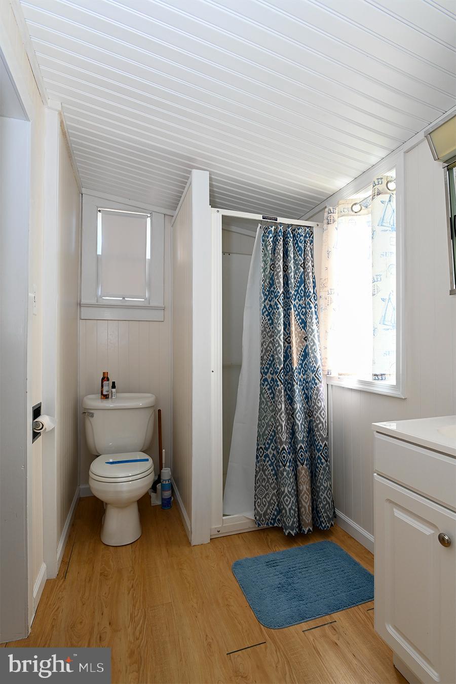 102 Garrison Avenue Fortescue, NJ 08321 - Photo 13 of 20 a bathroom with a toilet and a shower