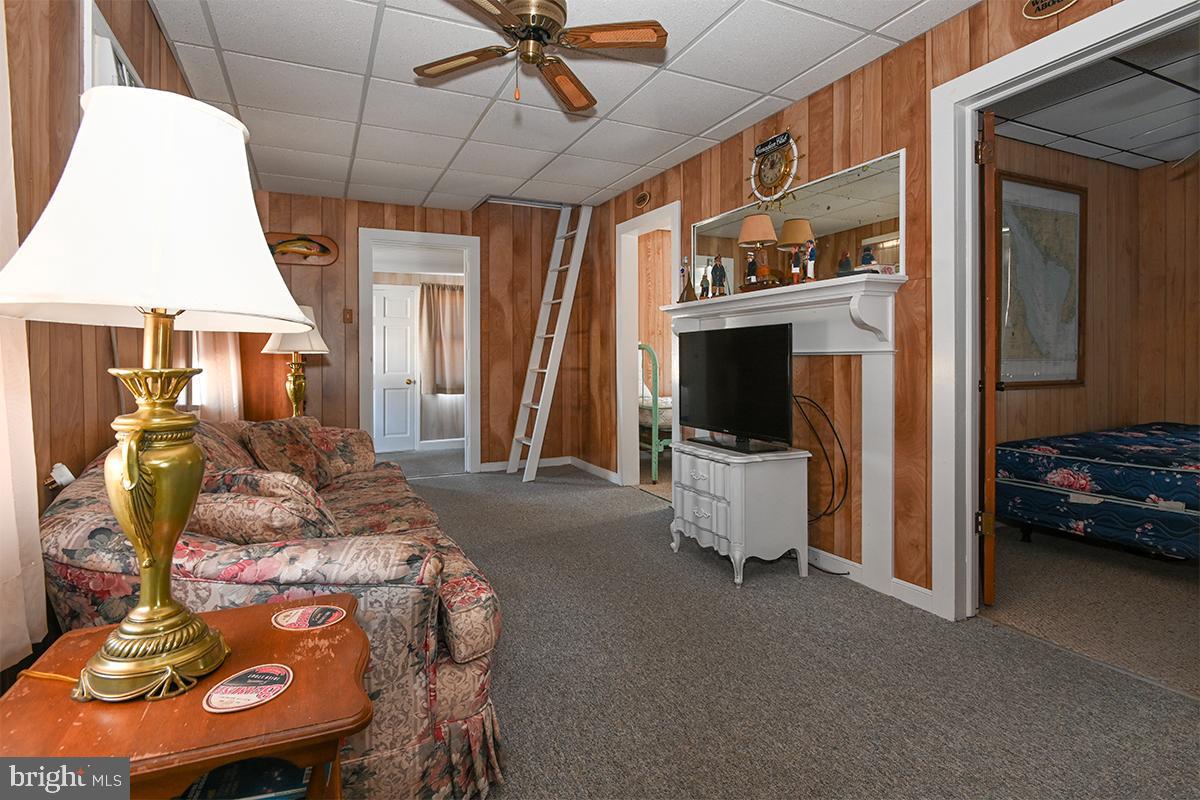 102 Garrison Avenue Fortescue, NJ 08321 - Photo 8 of 20 a living room with furniture and a flat screen tv