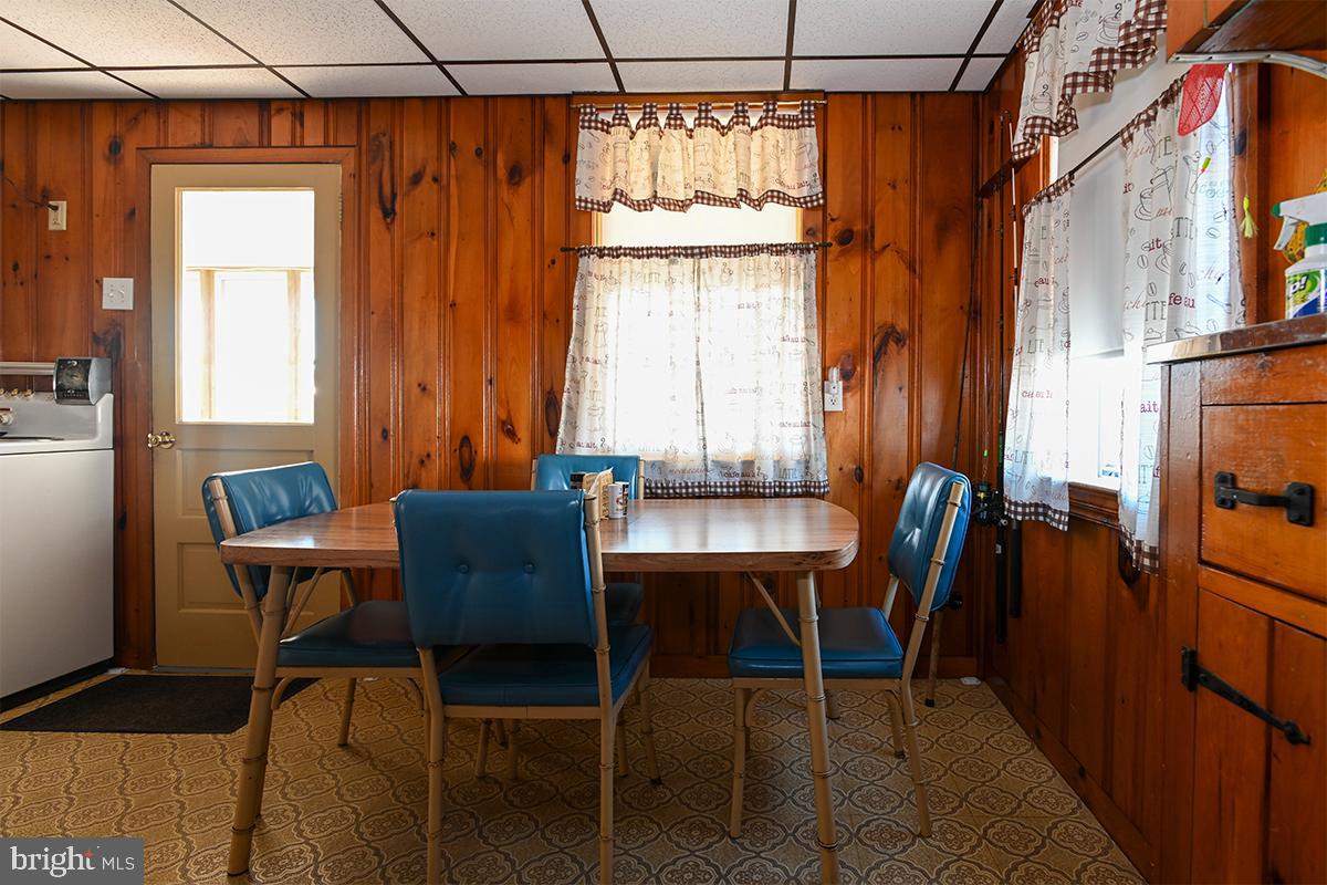 102 Garrison Avenue Fortescue, NJ 08321 - Photo 10 of 20 a dining room with furniture and window