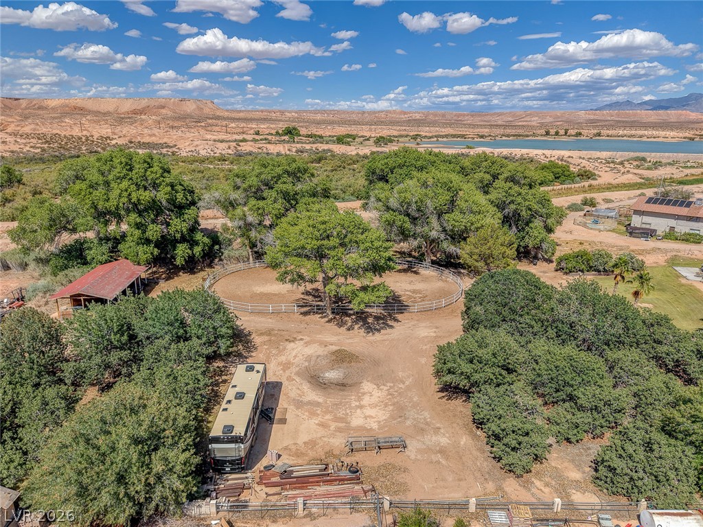 1950 Bowman Road Logandale, NV 89021 - Photo 61 of 81 Discover a tranquil rural setting with mature trees, a private horse corral, and distant water views.