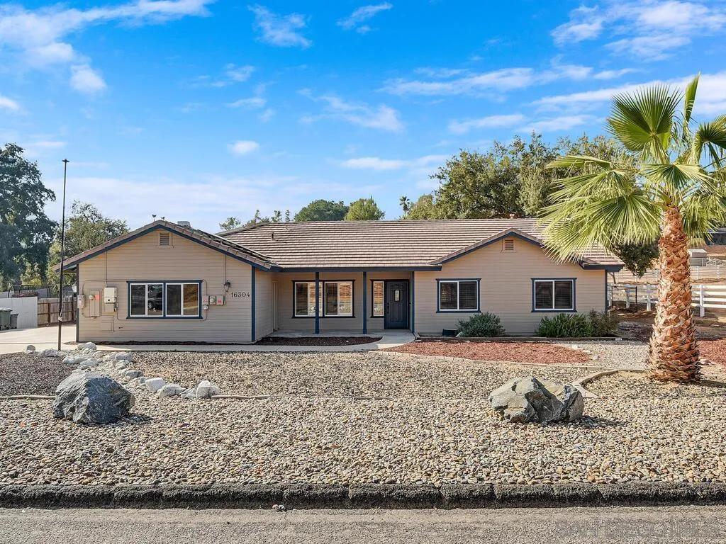 16304 Dartolo Road Ramona, CA 92065 - Photo 2 of 36 a house that has a tree in front of it