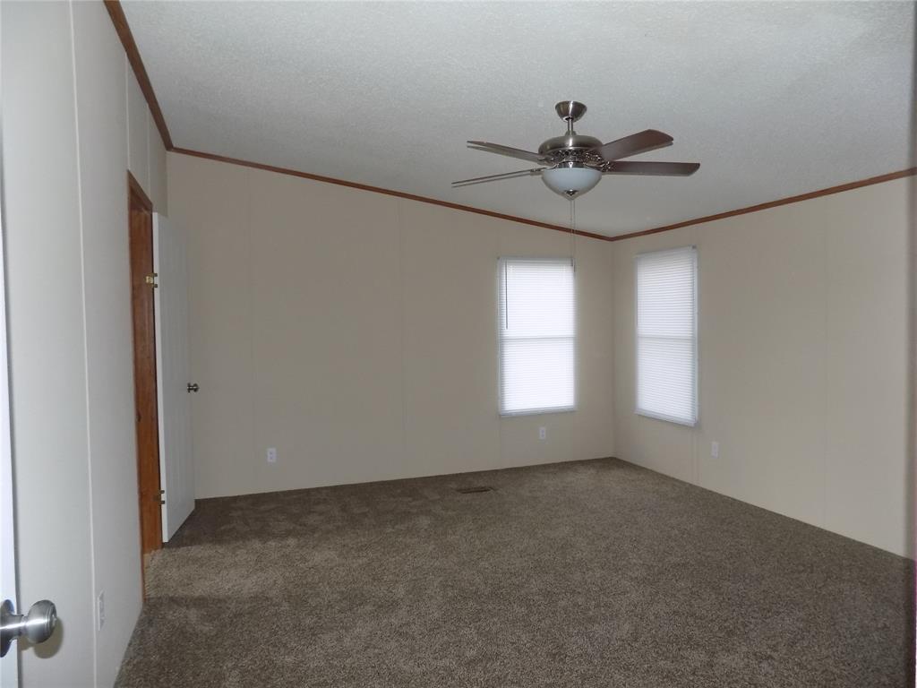 3450 Sarra Lane Springtown, TX 76082 - Photo 9 of 23 Spacious primary bedroom.