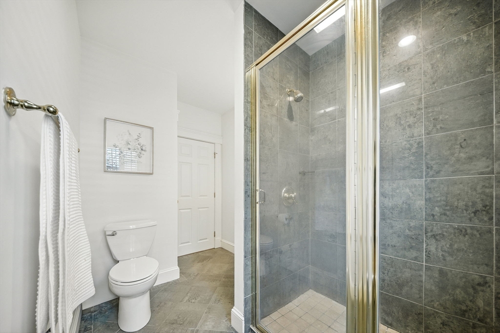 11 Dana Road Newton, MA 02465 - Photo 15 of 35 a bathroom with a toilet and a shower