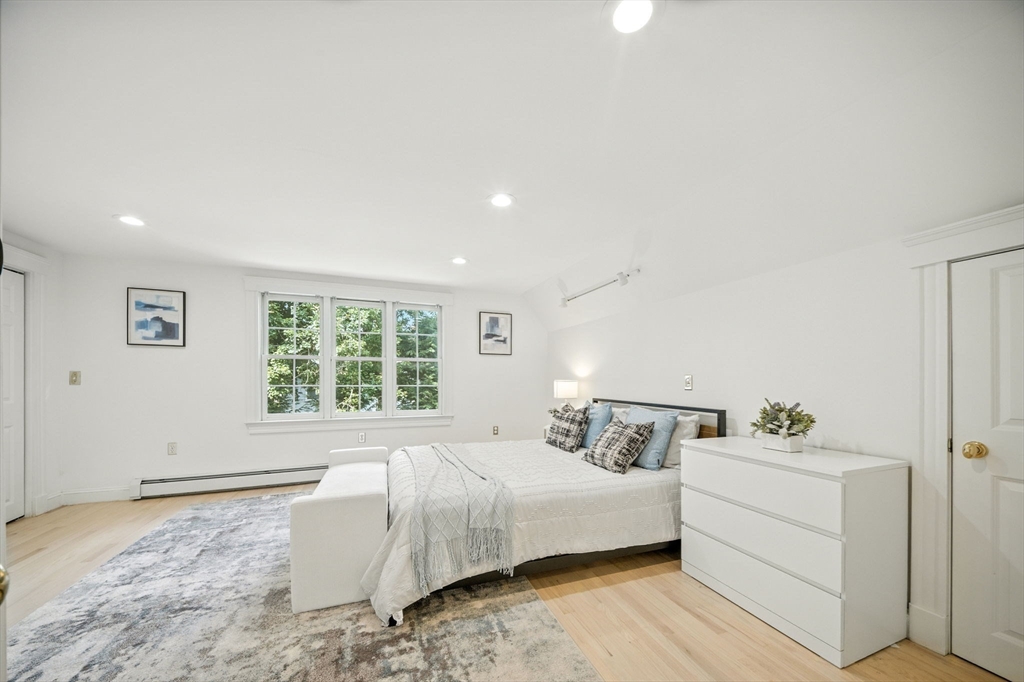 11 Dana Road Newton, MA 02465 - Photo 18 of 35 a bedroom with a bed and a window