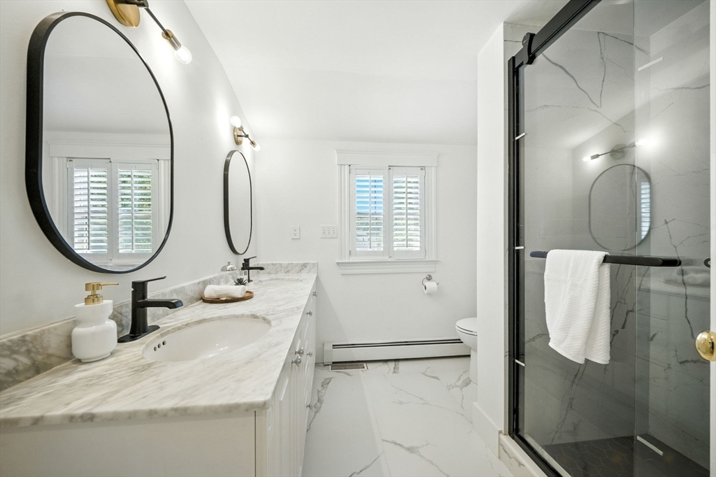 11 Dana Road Newton, MA 02465 - Photo 21 of 35 a bathroom with a sink and a mirror