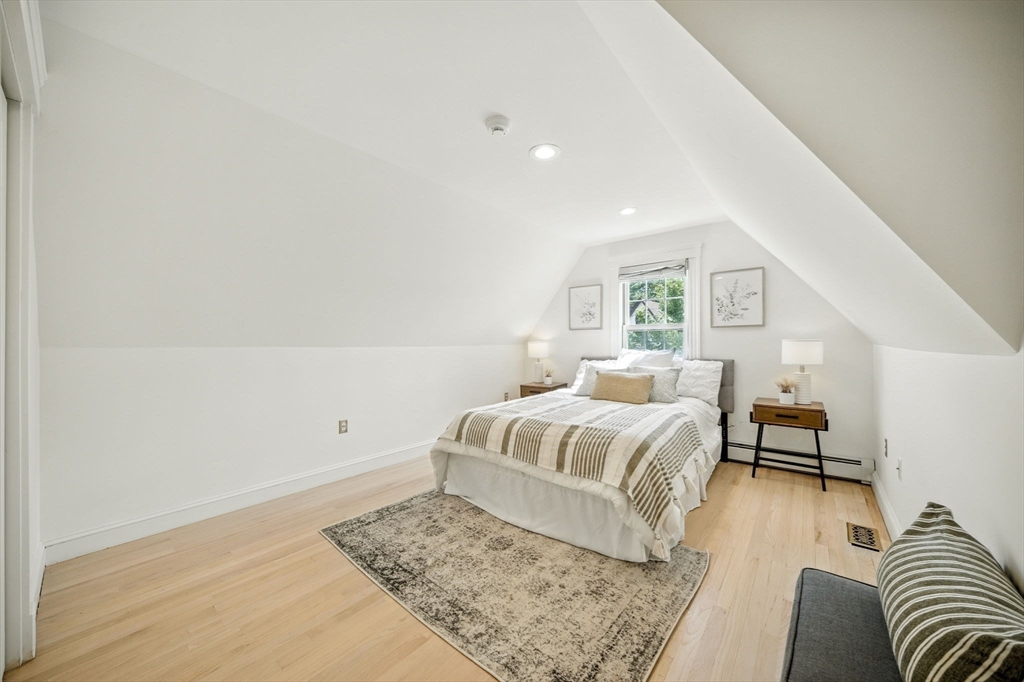 11 Dana Road Newton, MA 02465 - Photo 23 of 35 a bedroom with a bed and wooden floor