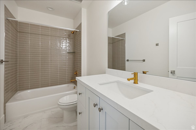 952 Mathilda Drive, Unit 156 Saratoga Springs, UT 84045 - Photo 24 of 25 Basement Bathroom between bedroom #2 and #3 Bathroom featuring a white vanity with shaker-style cabinetry, a white countertop with an integrated sink, and a gold-finish faucet