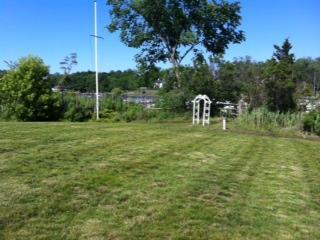 31 Shipway Road, Unit 129 Darien, CT 06820 - Photo 2 of 5 a view of a bench in a yard