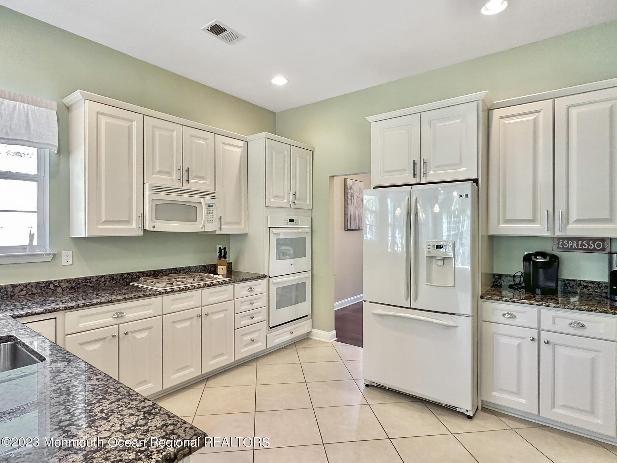 2 Arcaro Road Manalapan, NJ 07726 - Photo 13 of 42 a kitchen with granite countertop a refrigerator sink and cabinets