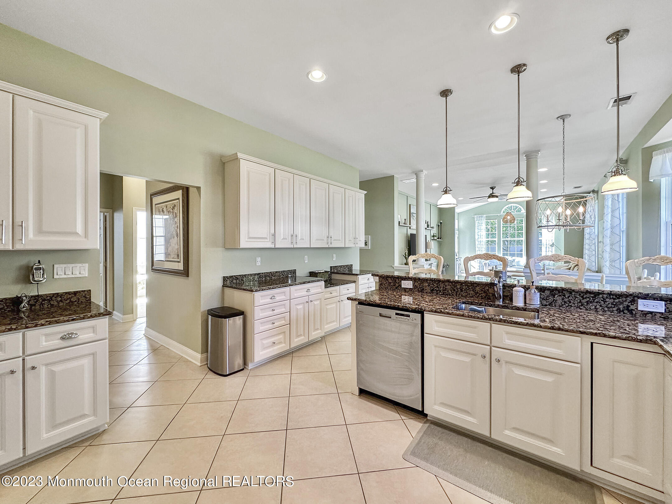 2 Arcaro Road Manalapan, NJ 07726 - Photo 15 of 42 a kitchen with a sink window and cabinets