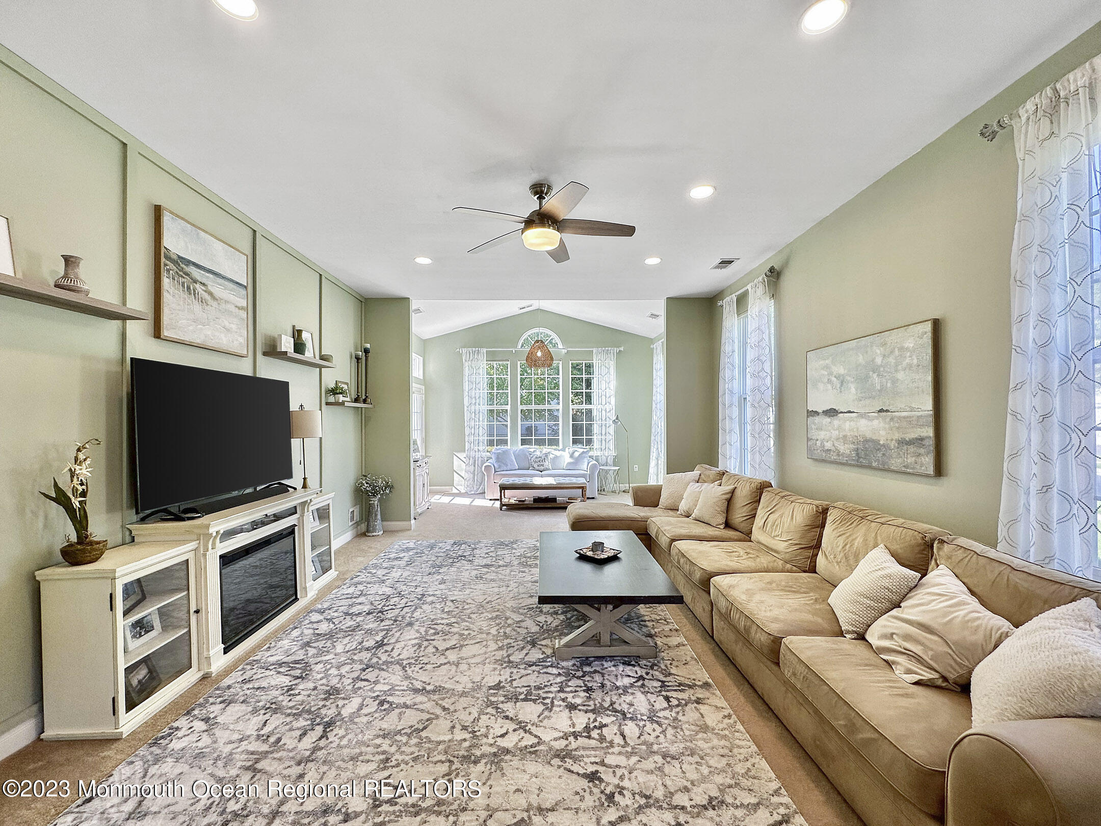 2 Arcaro Road Manalapan, NJ 07726 - Photo 19 of 42 a living room with furniture and a flat screen tv