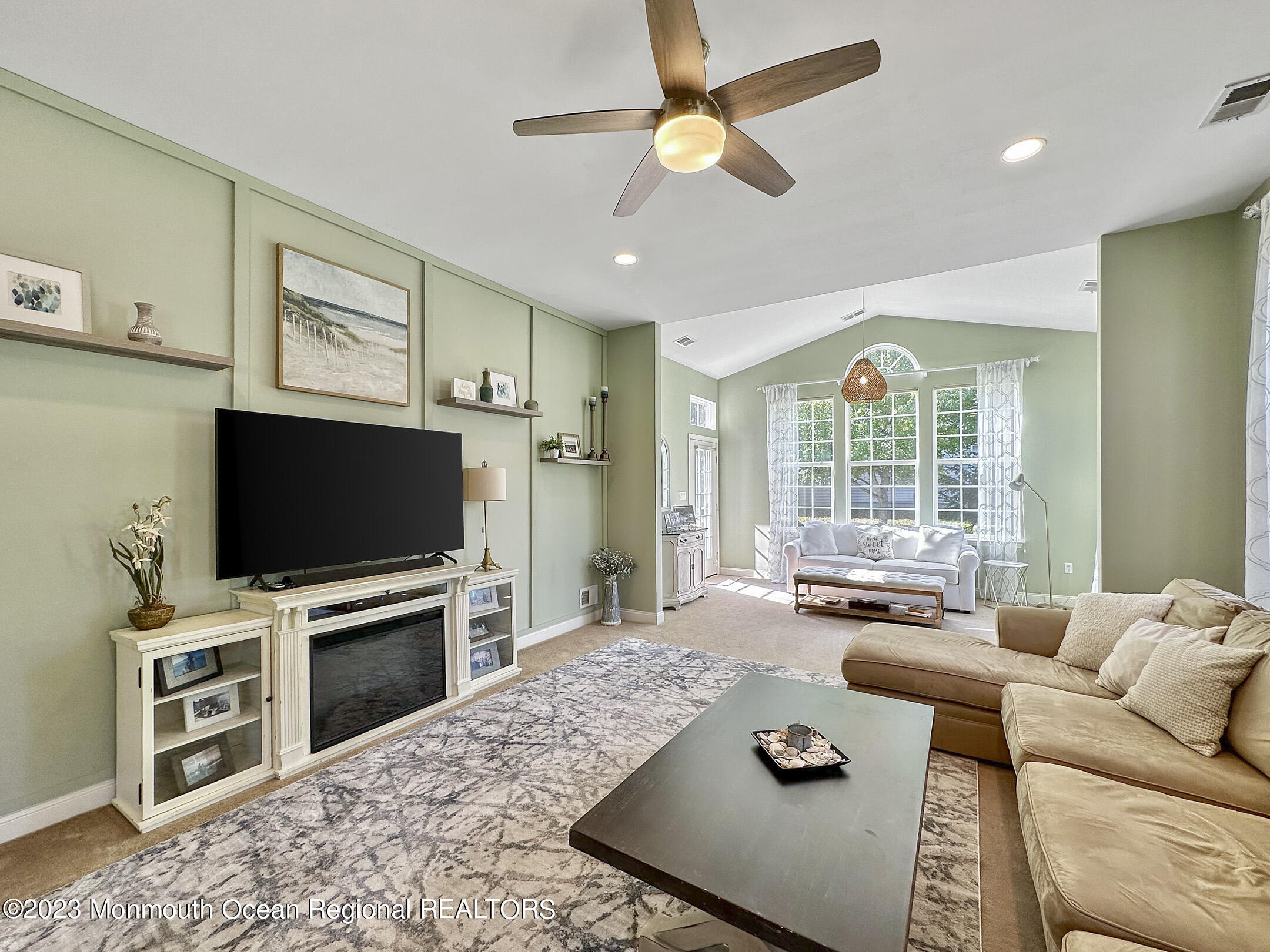 2 Arcaro Road Manalapan, NJ 07726 - Photo 20 of 42 a living room with furniture and a flat screen tv