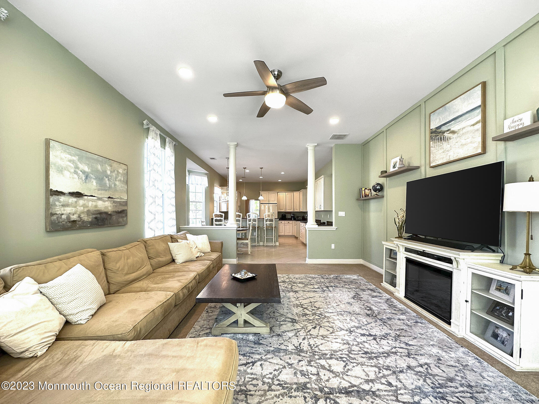 2 Arcaro Road Manalapan, NJ 07726 - Photo 24 of 42 a living room with furniture and a flat screen tv