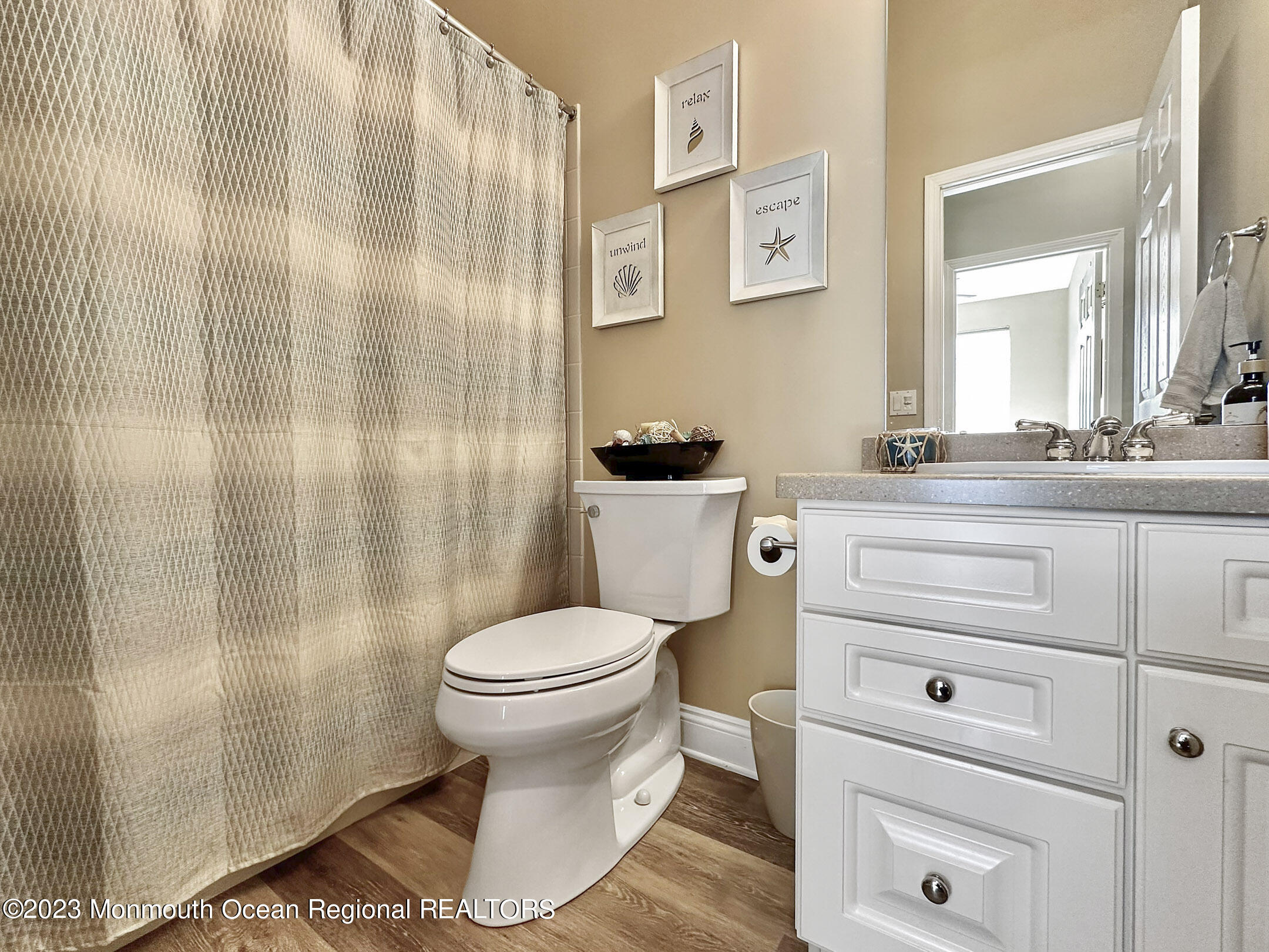 2 Arcaro Road Manalapan, NJ 07726 - Photo 30 of 42 a bathroom with a sink a toilet and shower