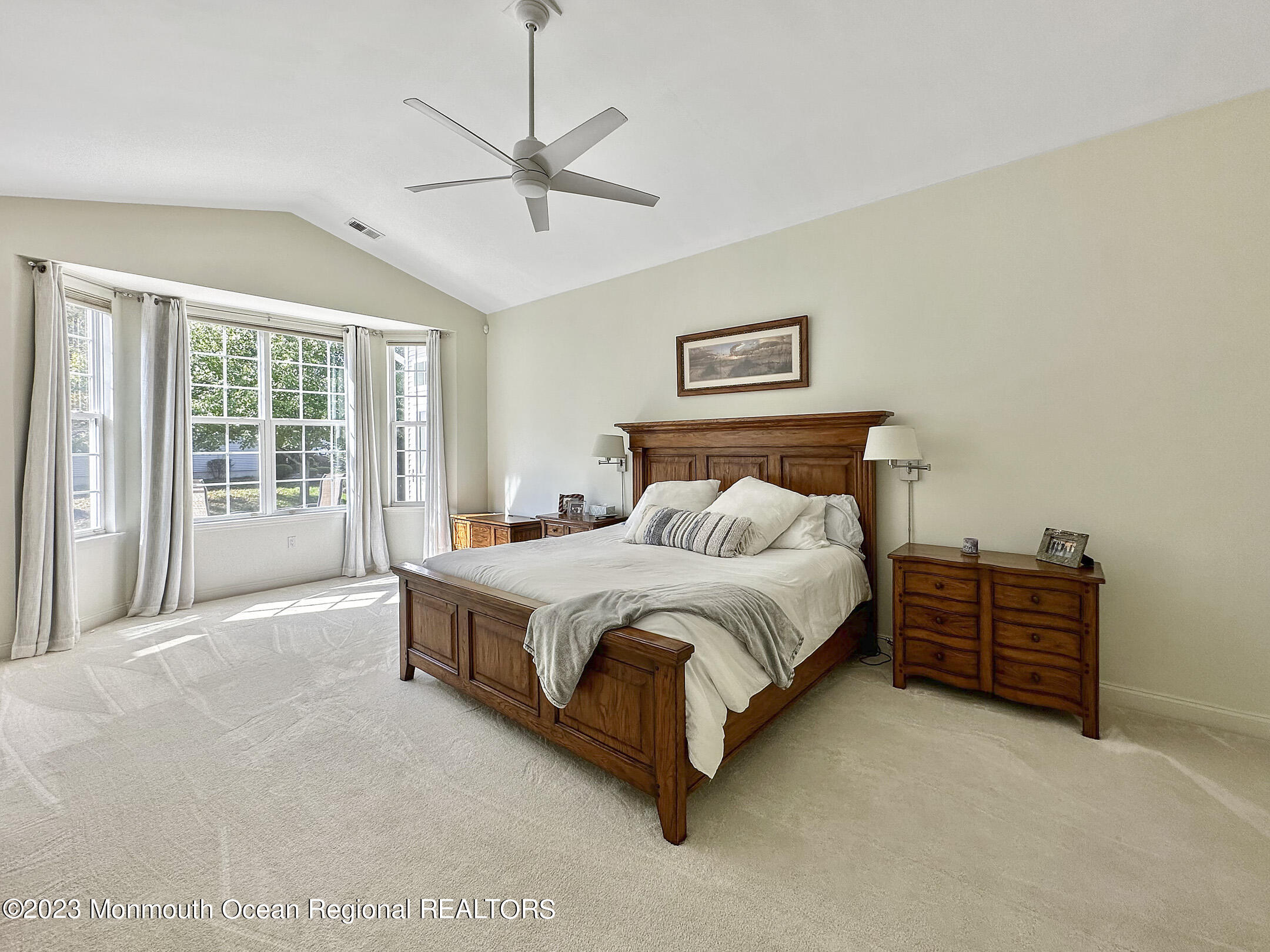 2 Arcaro Road Manalapan, NJ 07726 - Photo 32 of 42 a spacious bedroom with a bed and a chandelier