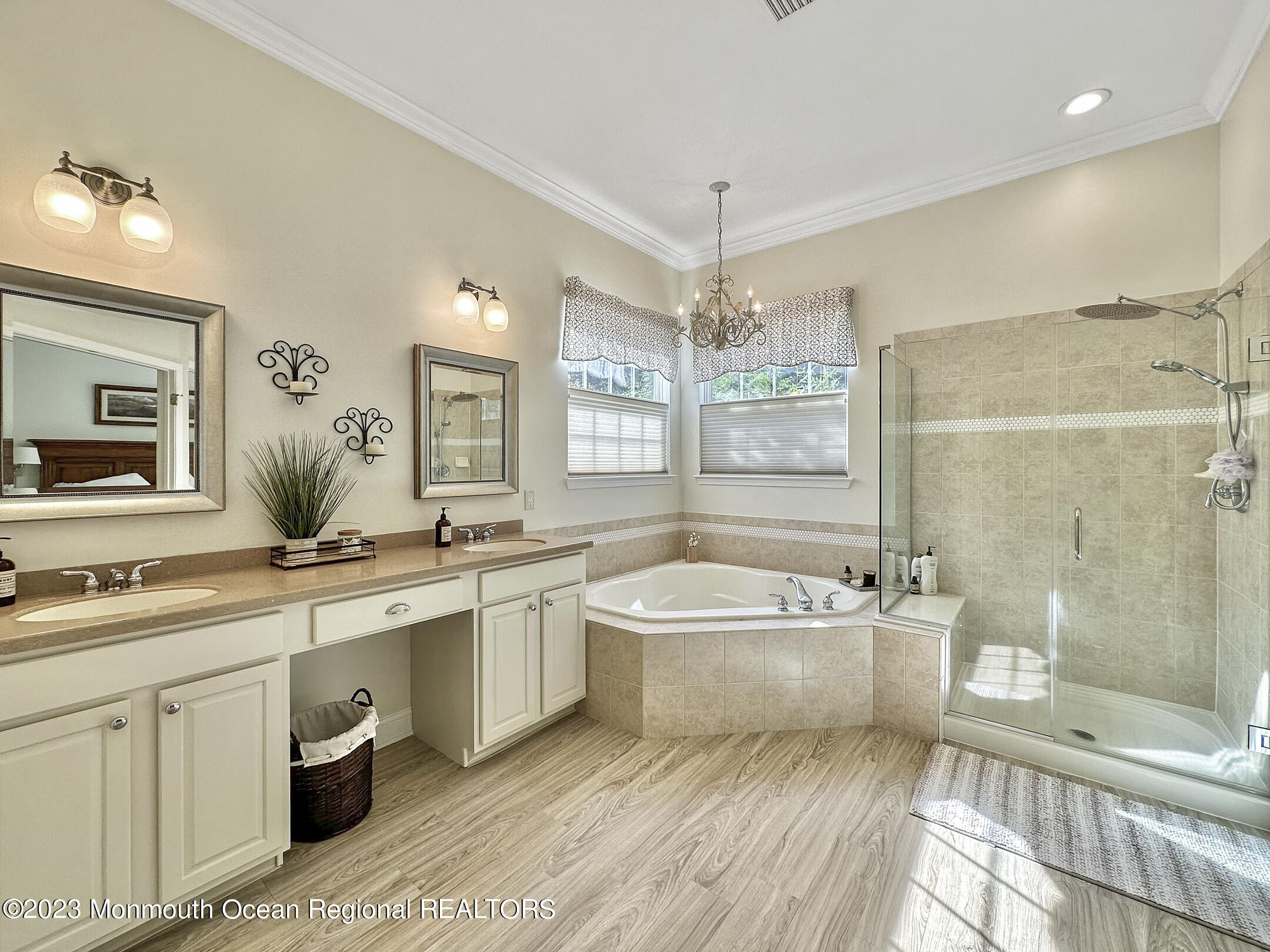 2 Arcaro Road Manalapan, NJ 07726 - Photo 35 of 42 a spacious bathroom with a double vanity sink a large mirror and a bathtub