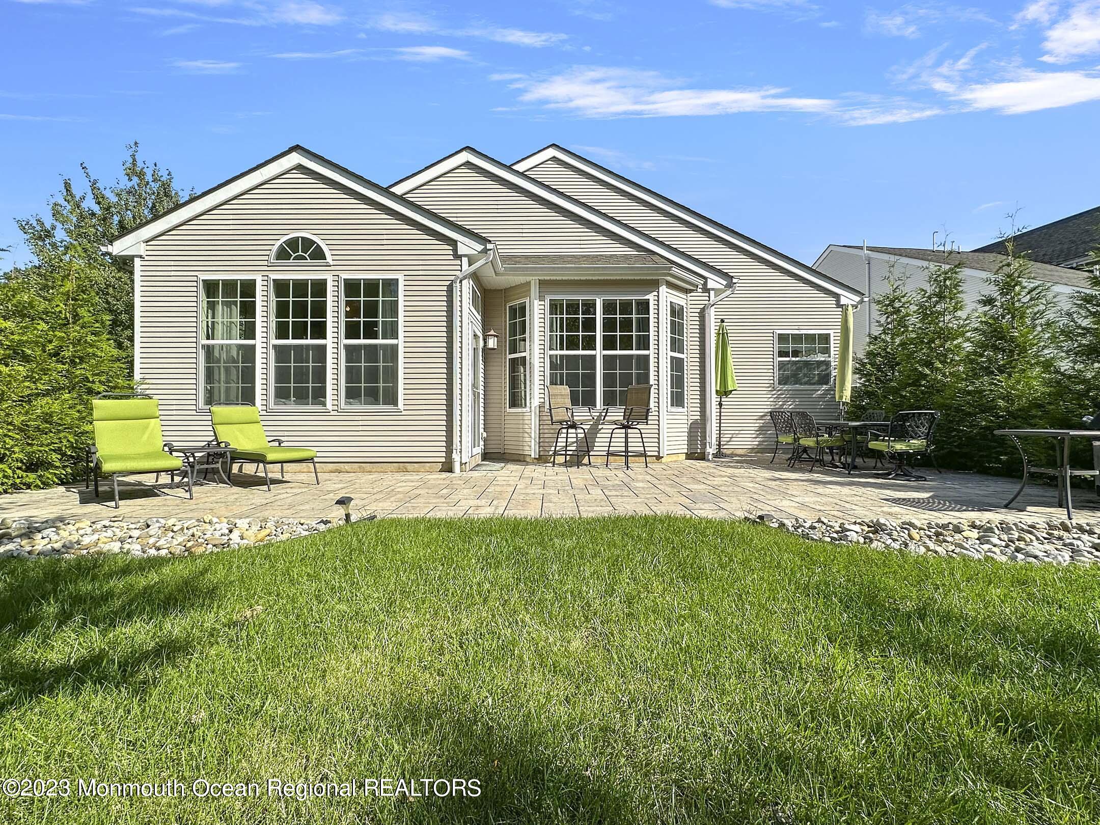 2 Arcaro Road Manalapan, NJ 07726 - Photo 36 of 42 a front view of a house with a yard