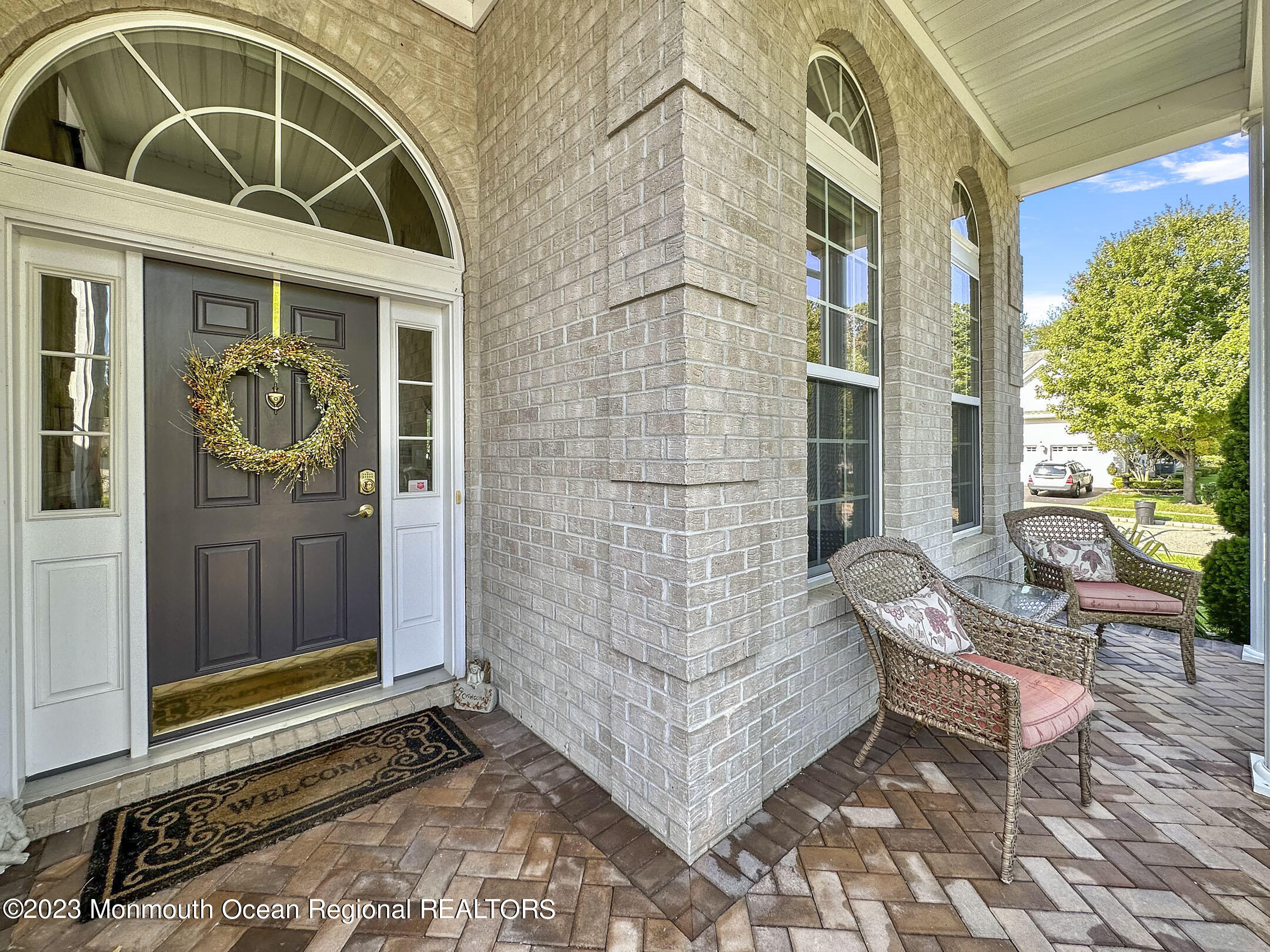 2 Arcaro Road Manalapan, NJ 07726 - Photo 4 of 42 a bench sitting in front of a building
