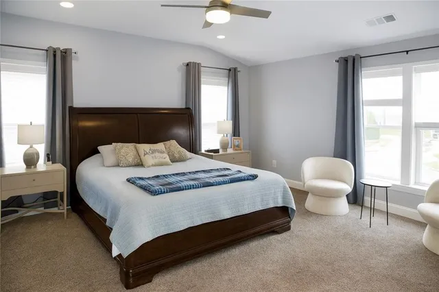 a bedroom with a bed and a couch