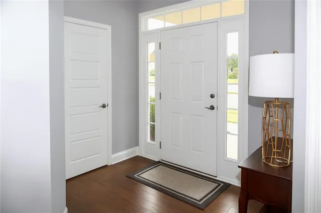 a view of a hallway with front door