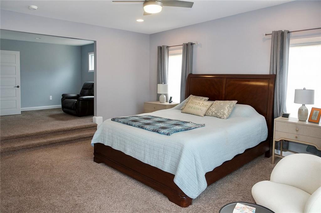 830 Commerce Trail Canton, GA 30114 - Photo 21 of 32 a bedroom with a bed and a couch