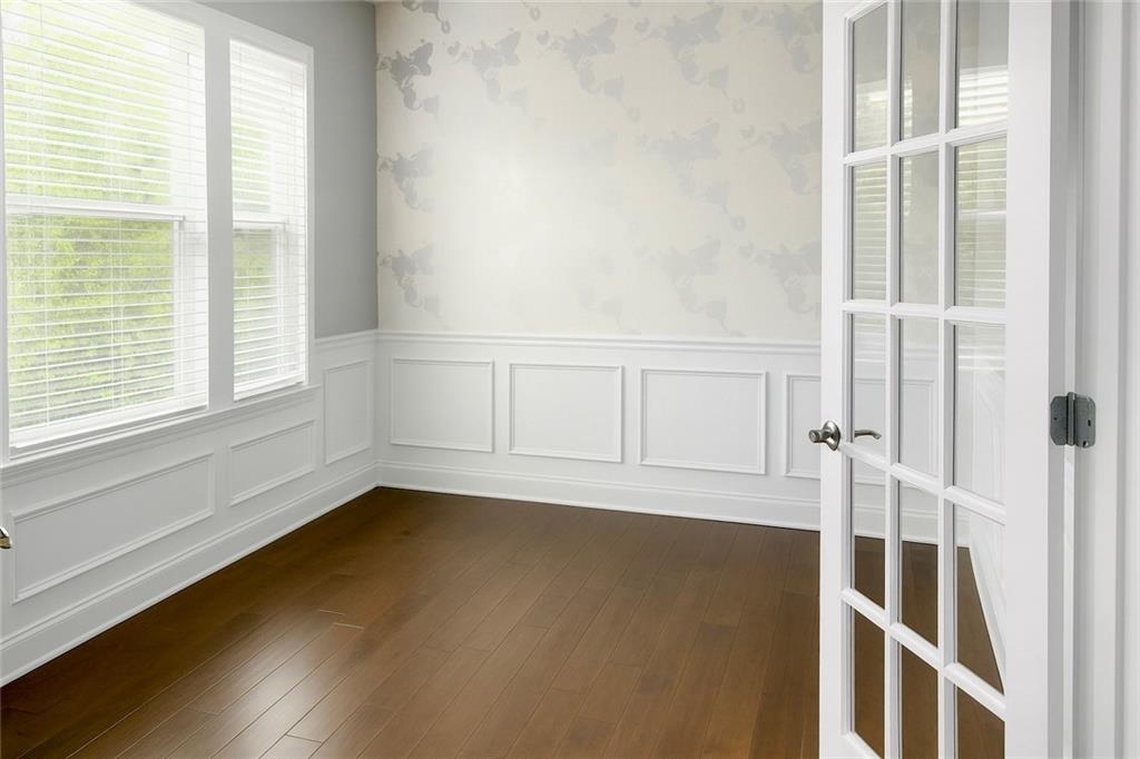 830 Commerce Trail Canton, GA 30114 - Photo 3 of 32 a view of a room with wooden floor and windows
