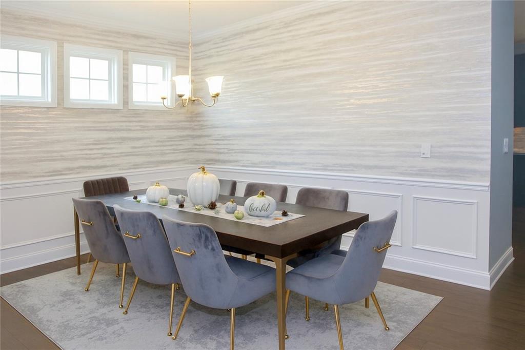 830 Commerce Trail Canton, GA 30114 - Photo 4 of 32 a view of a dining room with furniture and window