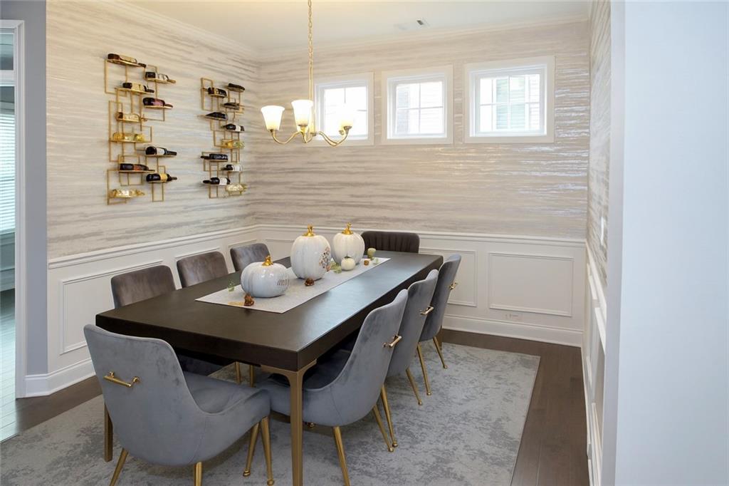 830 Commerce Trail Canton, GA 30114 - Photo 5 of 32 a view of a dining room with furniture and wooden floor