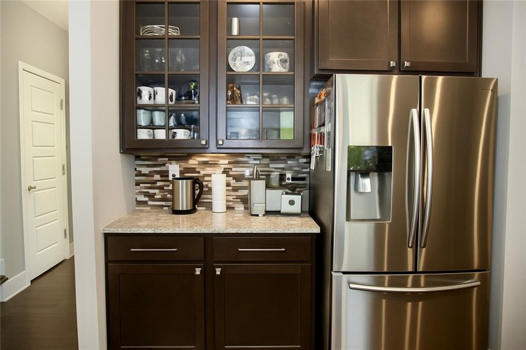830 Commerce Trail Canton, GA 30114 - Photo 8 of 32 a kitchen with stainless steel appliances granite countertop a refrigerator and a cabinets
