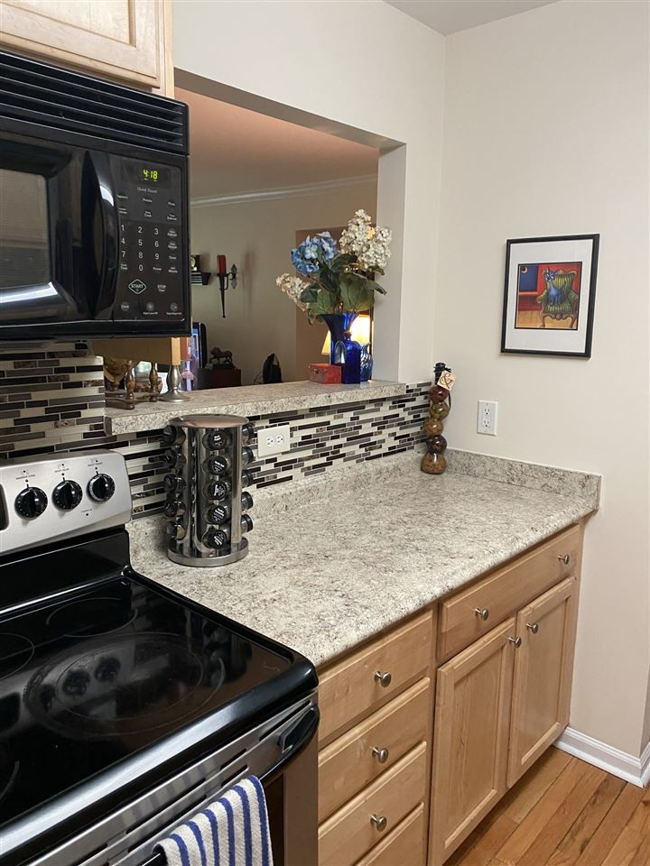2308 Myron Drive, Unit 104 Raleigh, NC 27607 - Photo 8 of 16 a kitchen with sink stove and cabinets