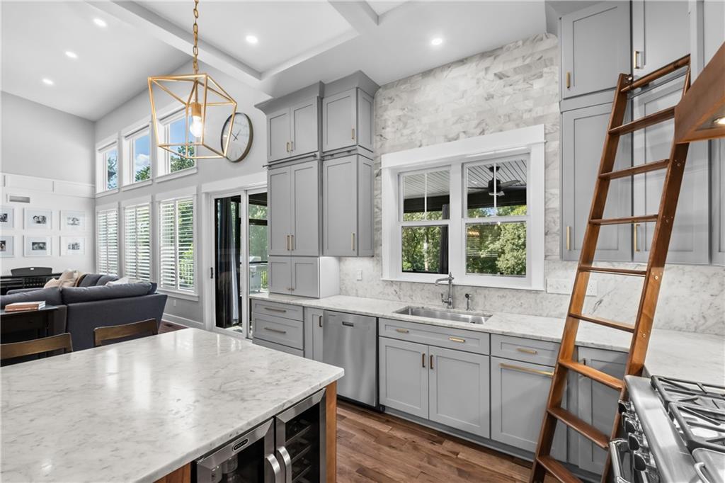 211 McMichael Road Carnegie, PA 15106 - Photo 12 of 50 a large kitchen with a large window and a clock on a table