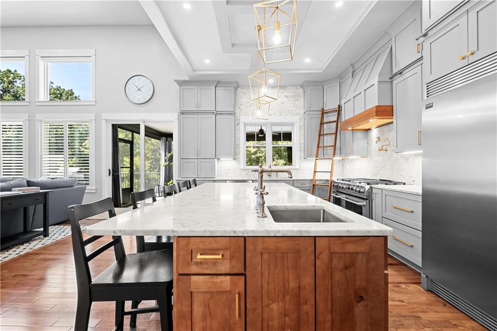 211 McMichael Road Carnegie, PA 15106 - Photo 14 of 50 a kitchen with stainless steel appliances granite countertop a sink and a refrigerator