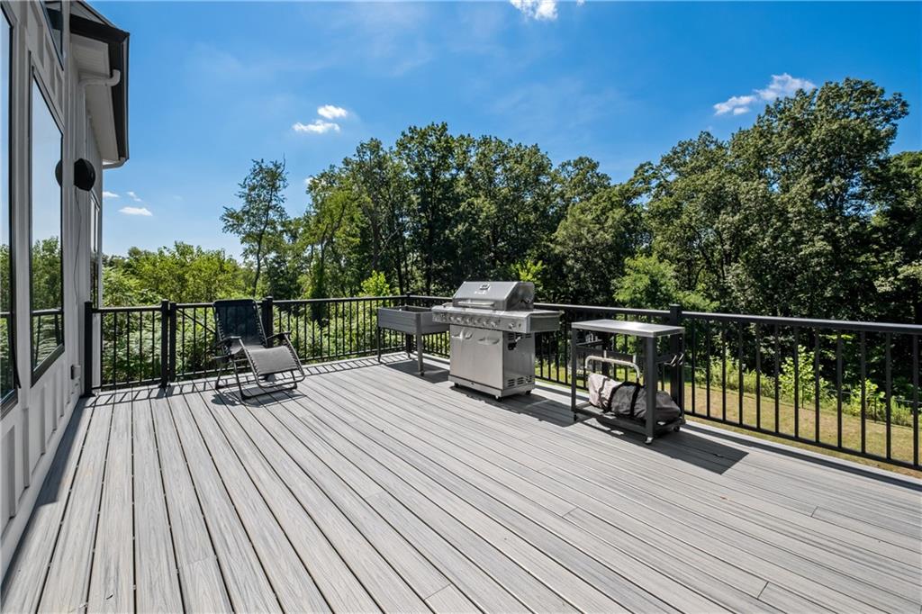 211 McMichael Road Carnegie, PA 15106 - Photo 17 of 50 a view of house with deck outdoor seating and trees in the background