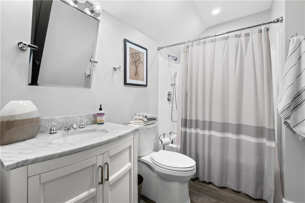 211 McMichael Road Carnegie, PA 15106 - Photo 25 of 50 a bathroom with a sink a toilet and shower curtain