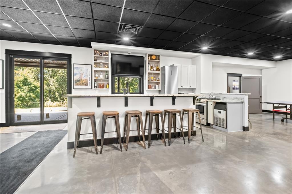 211 McMichael Road Carnegie, PA 15106 - Photo 33 of 50 a view of a kitchen with stainless steel appliances granite countertop a table chairs and a large window