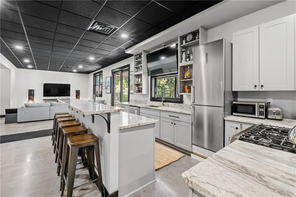 211 McMichael Road Carnegie, PA 15106 - Photo 35 of 50 a kitchen with cabinets and chairs