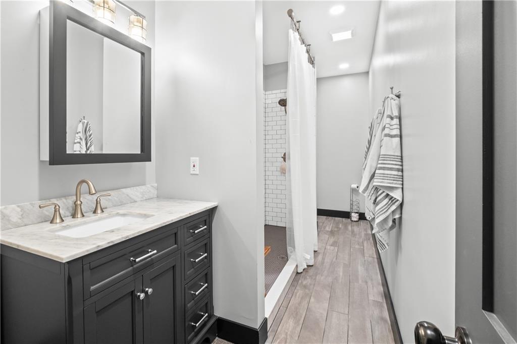 211 McMichael Road Carnegie, PA 15106 - Photo 38 of 50 a bathroom with a sink a mirror and a shower