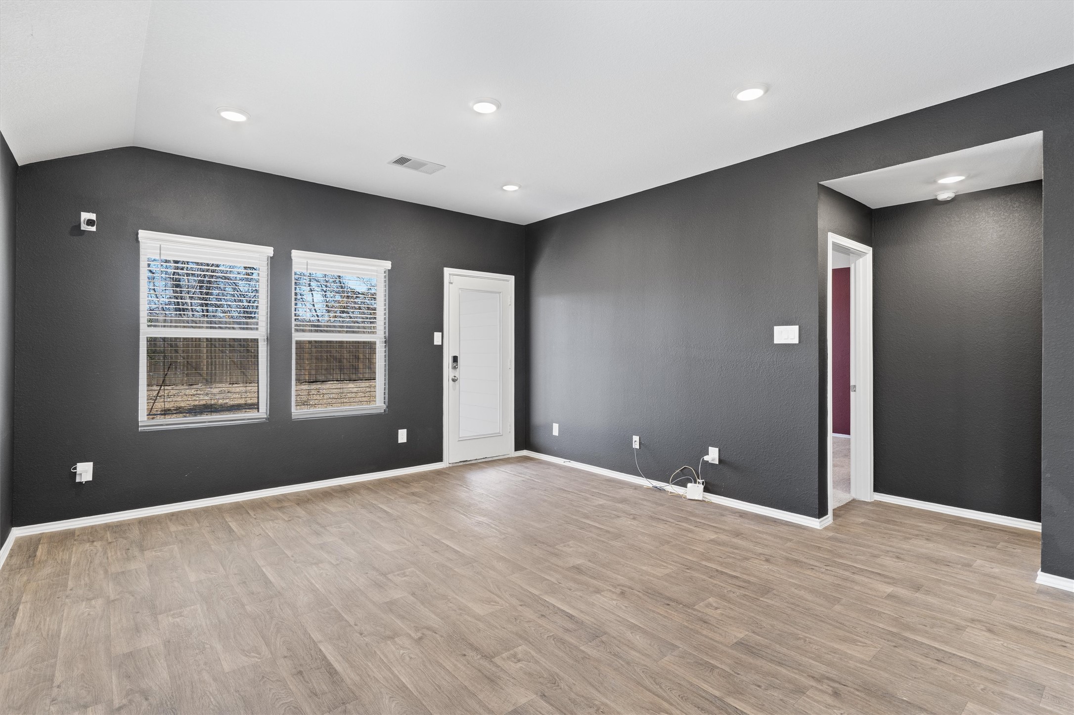 352 Sickle Loop Uhland, TX 78640 - Photo 17 of 36 Spacious living area with high ceilings and recessed lighting.
