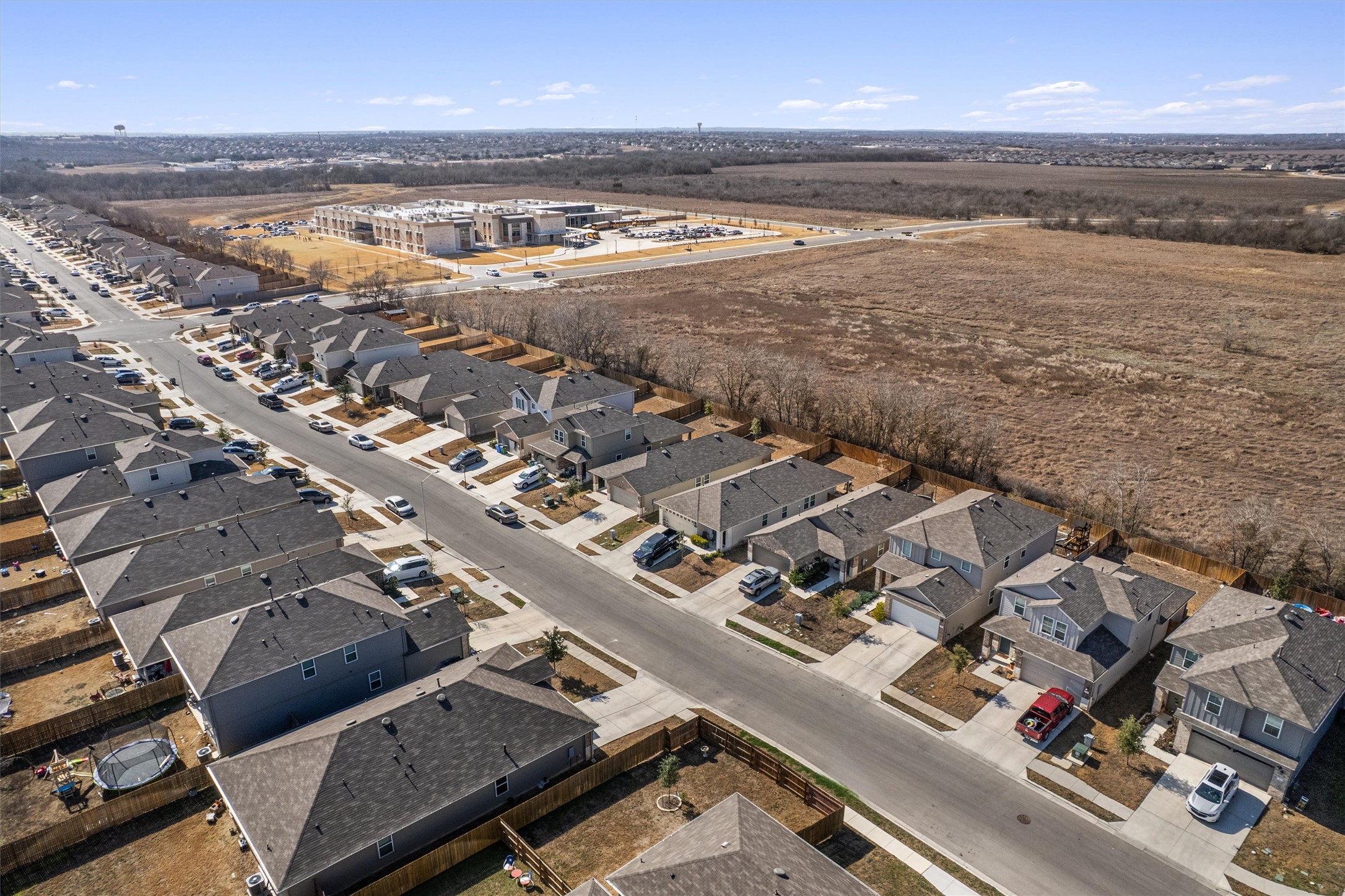 352 Sickle Loop Uhland, TX 78640 - Photo 2 of 36 Aerial view of property and surrounding area with nearby suburban area