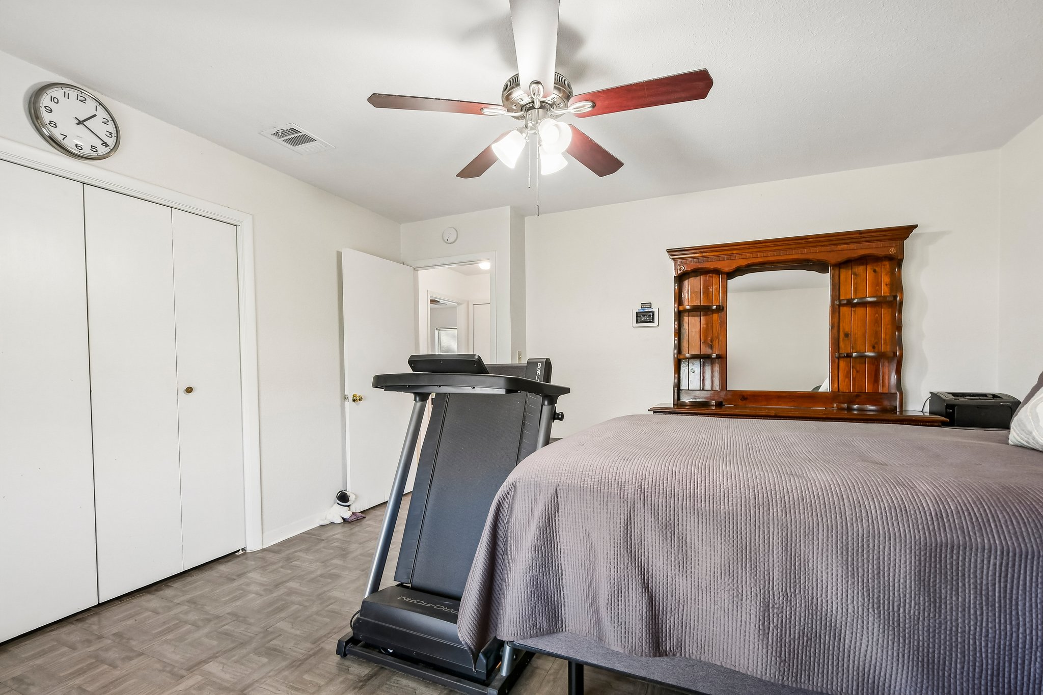 101 Brown Street Elgin, TX 78621 - Photo 19 of 32 a room with a bed and a large mirror