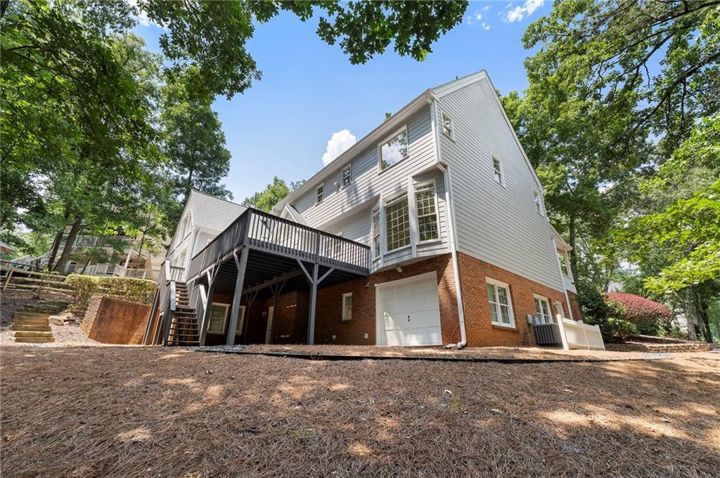 8965 Laurel Way Alpharetta, GA 30022 - Photo 60 of 79 a front view of a house with a yard