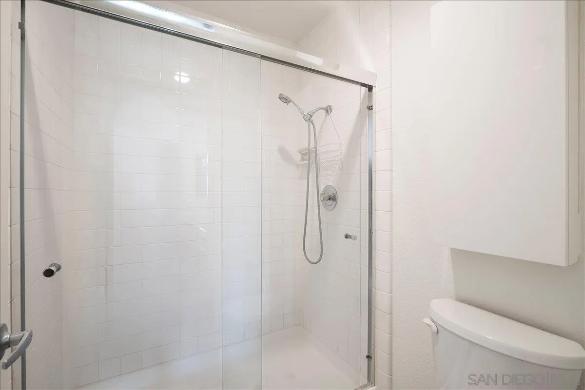 2315 Rancho Del Oro Drive, Unit 14 Oceanside, CA 92056 - Photo 15 of 34 a bathroom with a shower and toilet