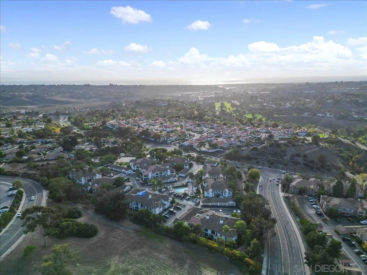 2315 Rancho Del Oro Drive, Unit 14 Oceanside, CA 92056 - Photo 23 of 34 an aerial view of residential house with outdoor space and trees